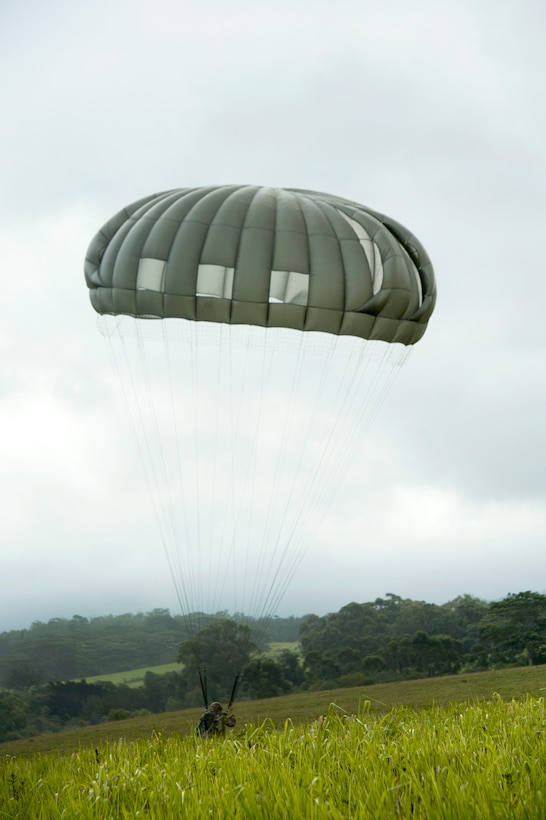 A U.S. soldier performs a parachute landing fall during static line airborne operation.