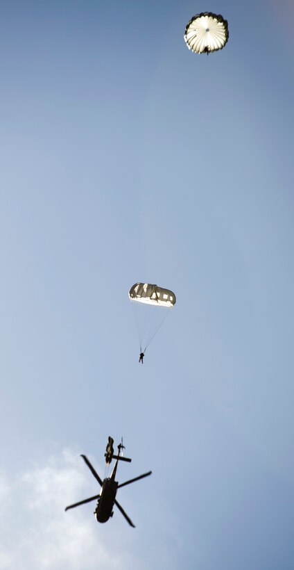 Multinational special operations forces conduct static line airborne insertion operation.
