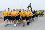 Sailors deployed to Camp Lemonnier, Djibouti, participate in an early morning group run as part of Chief Petty Officer 365 training.