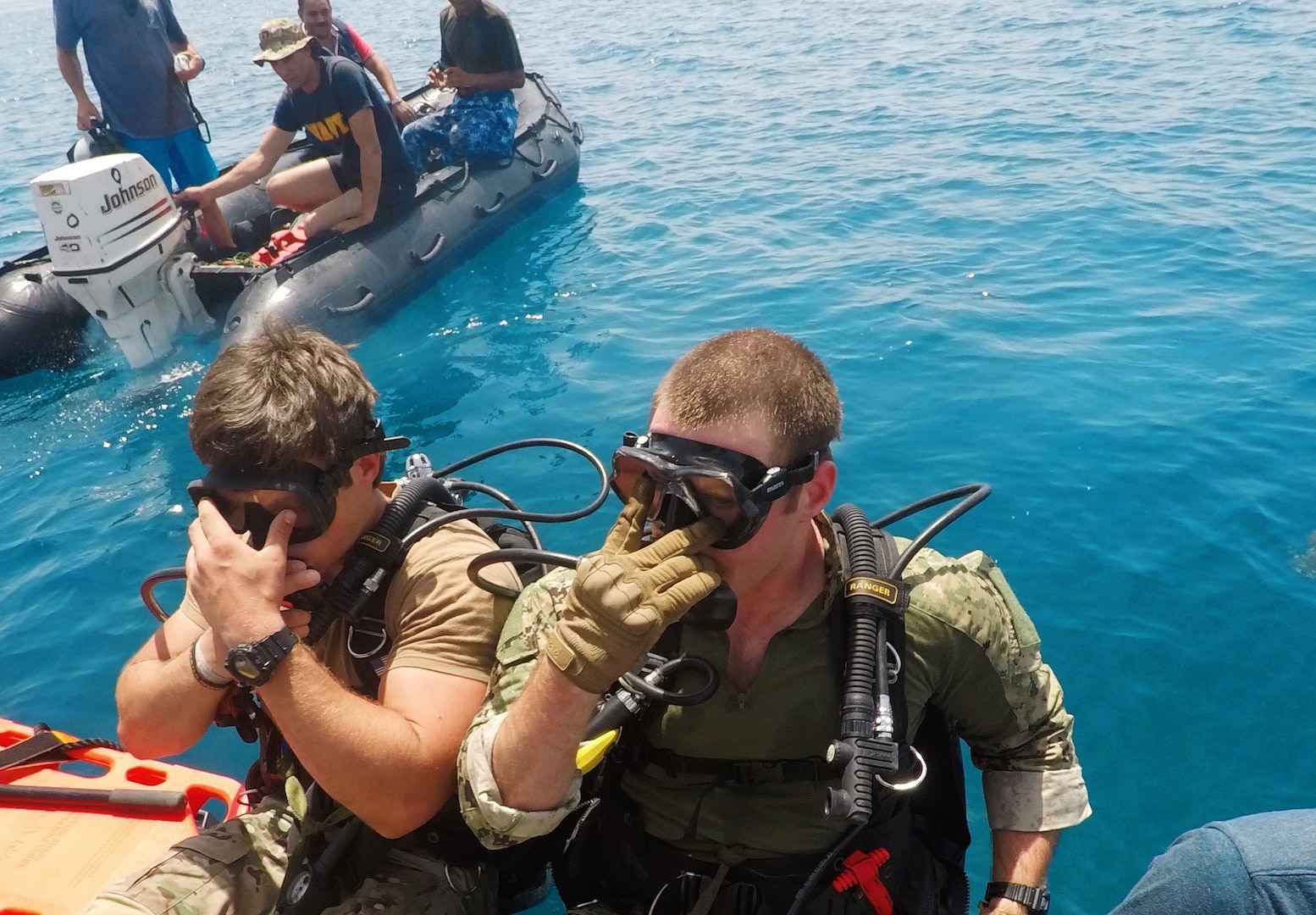 Sailors deployed to U.S. 5th Fleet’s Task Group 52.3 prepare to depart a boat  during a familiarization dive with the Egyptian Naval Force (ENF) during Eagle Response 18. Eagle Response 18 is an explosive ordnance disposal and diving exercise with the ENF conducted to enhance interoperability and war-fighting readiness, fortify military-to-military relationships and advance operational capabilities of all participating units. (U.S. Navy photo by Lt. Chloe Morgan/Released)