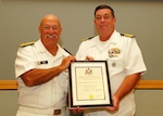 Retired Navy Rear Adm. John King (left), stands with retiring Navy Capt. Daniel Hodgson during a retirement ceremony July 20. Hodgson, who last served as the director of DLA Troop Support’s C&E supply chain, retired after 27 years.