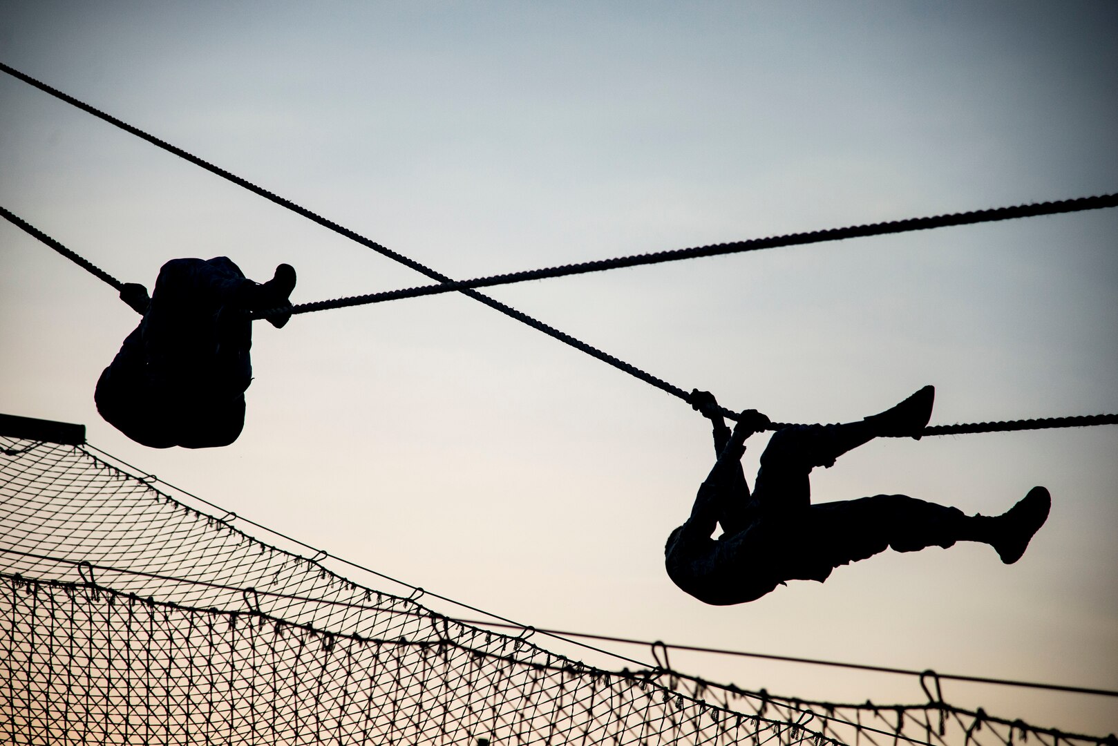 Security Forces Airmen descend a rope July 23, 2018, at Joint Base San Antonio-Camp Bullis, Texas in preparation for the 2018 Defender Challenge. The competition will pit security forces teams against each other in realistic weapons, dismounted operations and relay challenge events. (U.S. Air Force photo by Senior Airman Stormy Archer)