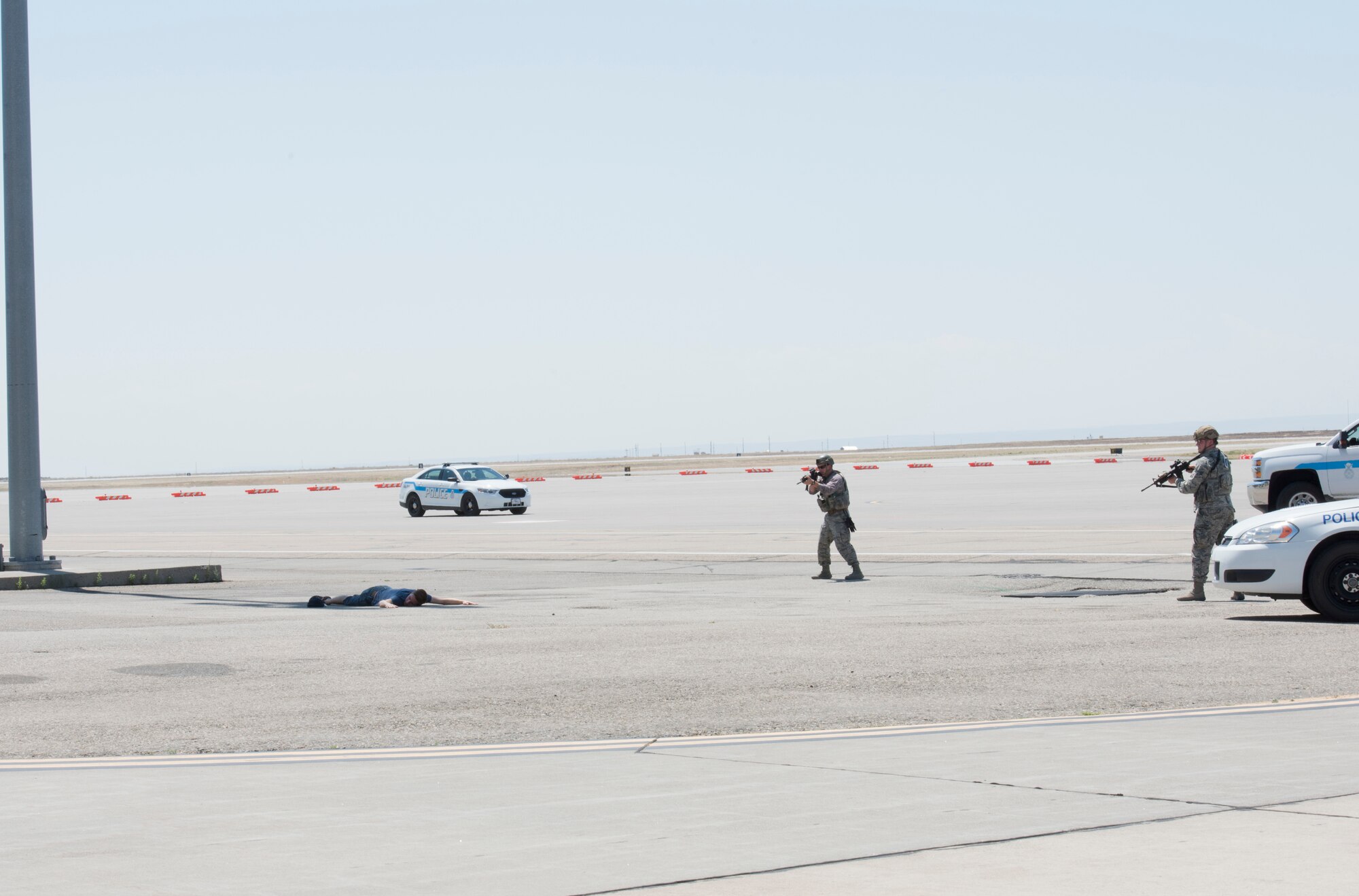 Members of the 366th Security Forces squadron prepare to apprehend Airman 1st Class Trevor Gordnier, 366th Fighter Wing broadcast journalist, during a Force Protection Condition exercise, July 23, 2018, at Mountain Home Air Force Base, Idaho. The exercise tested the wing’s ability to execute the proper procedures associated with different FPCONs during a wide variety of scenarios. (U.S. Air Force photo by Airman 1st Class Alaysia Berry)
