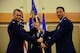 Maj. Frank Schiavone, right, accepts command of the 341st Contracting Squadron from Col. Marcus Glenn, 341st Mission Support Group commander, during an assumption of command ceremony July 26, 2018, at the Grizzly Bend at Malmstrom AFB, Mont.