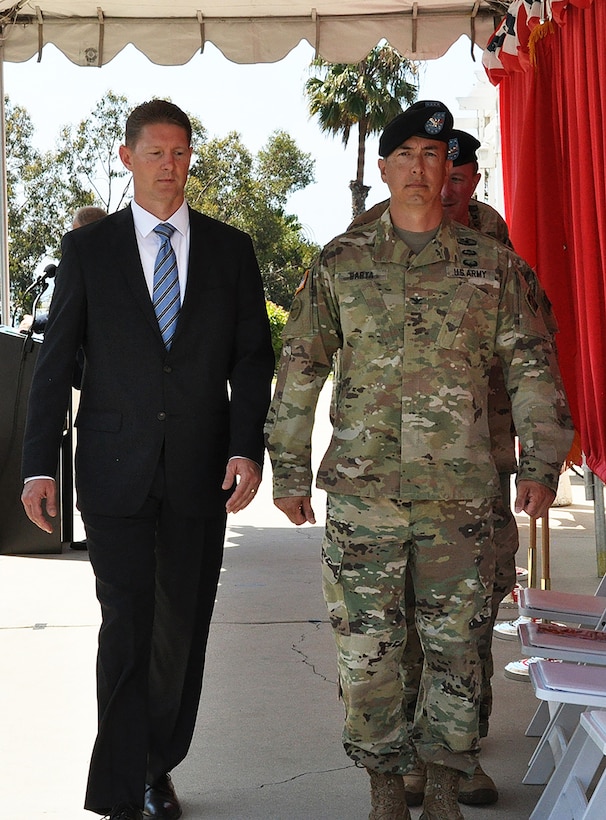 Col. Aaron Barta, U.S. Army Corps of Engineers Los Angeles District commander, right, and David Van Dorpe, District deputy for programs and project management, LA District, left, walk to their places on the stage during a July 19 Change of Command ceremony at Fort MacArthur in San Pedro, California. During the ceremony, Col. Kirk Gibbs, former LA District commander, relinquished duties to Barta.