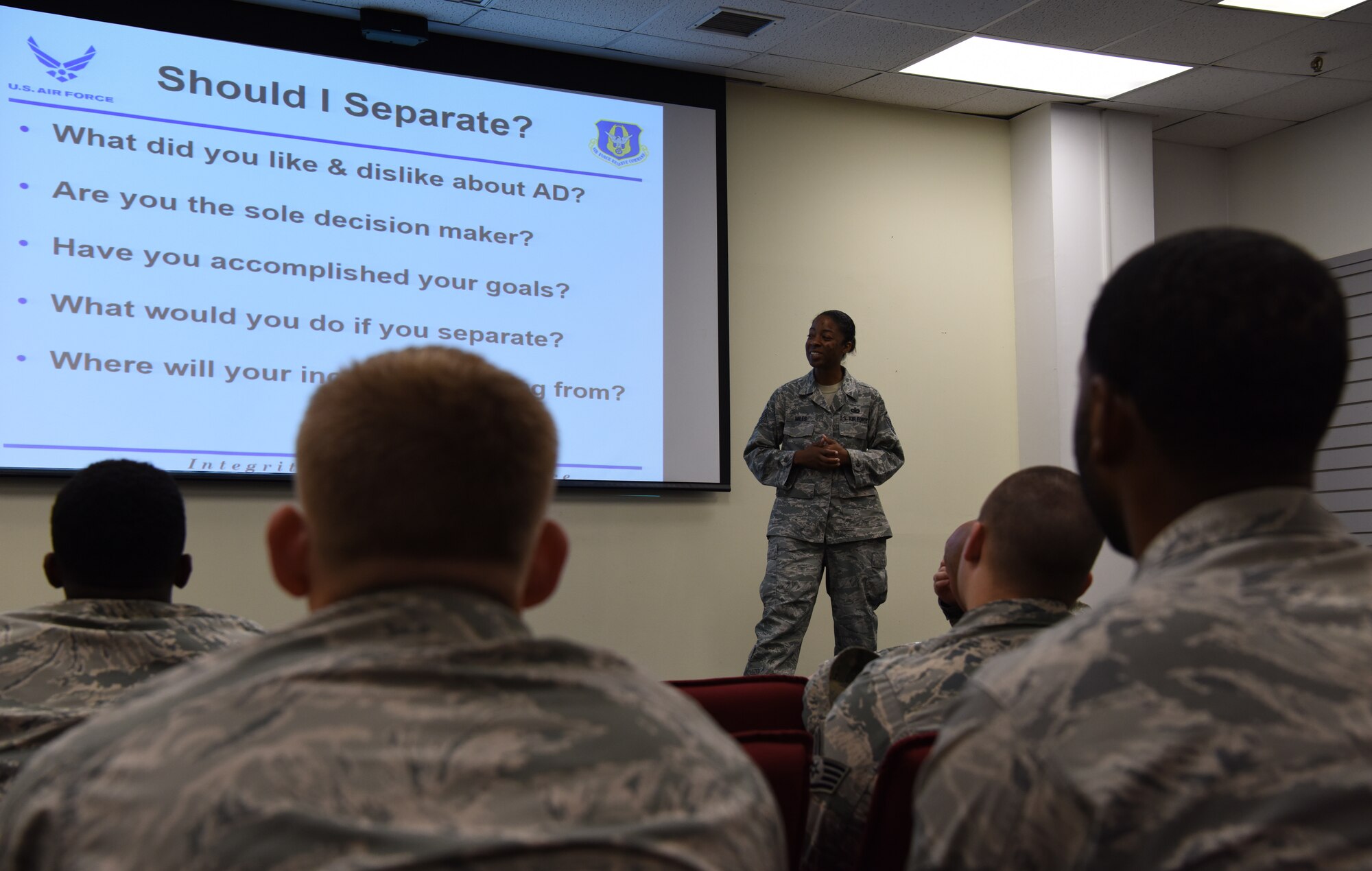 Airmen assigned to the 8th Fighter Wing attend a Palace Chase and Palace Front brief at Kunsan Air Base, Republic of Korea, July 19, 2018. U.S. Air Force Master Sgt. Venita Miles, Pacific Air Forces in-service recruiter traveled to the Korean peninsula to educate Airmen on transitioning from active-duty to the reserves.