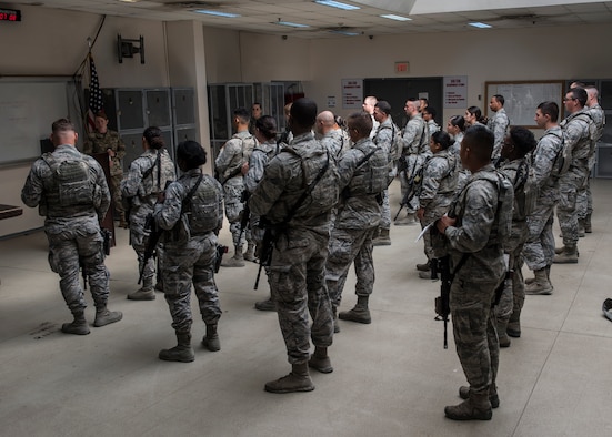U.S. Air Force members assigned to the 39th Security Forces Squadron contingency operations, receive a briefing during guard mount at Incirlik Air Base, Turkey, July 26, 2018.