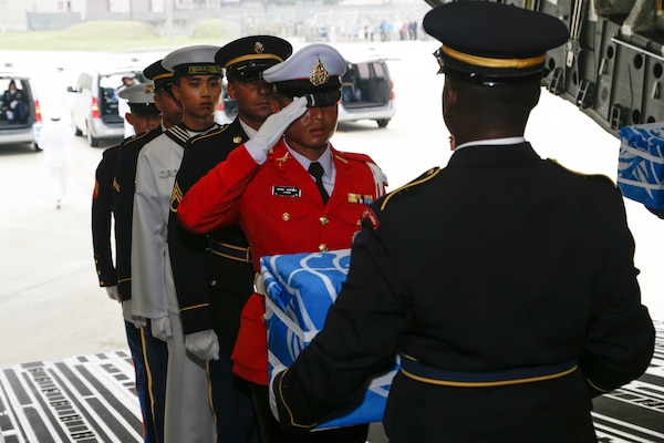 United Nations Honor Guard members carry the remains of fallen service members during a dignified return ceremony at Osan Air Base, South Korea, July 27, 2018. Members of the command and the Osan community were on hand at the arrival ceremony. Army photo by Sgt. Quince Lanford