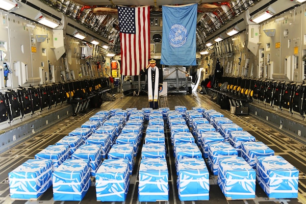 United Nations Command Chaplain Army Col. Sam Lee performs a blessing of sacrifice and remembrance on the 55 cases of remains returned by North Korea at Osan Air Base, South Korea, July 27, 2018. Army photo by Sgt. Quince Lanford