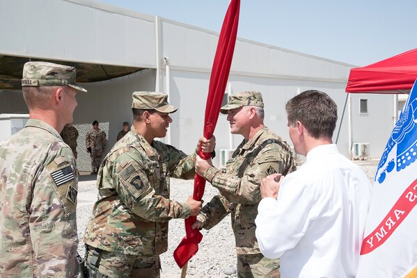 Col. Mark Quander, Transatlantic Division Commander, charges Col. Philip Secrist with command of the Mosul Dam Task Force through the passing of the USACE flag. Col. Mike Farrell, left, and Creg Hucks, right, observe the ceremonial event.