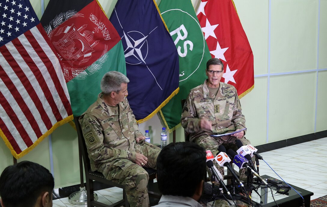 KABUL, Afghanistan (July 23, 2018) -- Gen. John Nicholson, Resolute Support commander, and Gen. Joseph Votel, U.S. Central Command commander, speak with media during a press conference at Resolute Support headquarters, July 23. (NATO photo by Erickson Barnes)