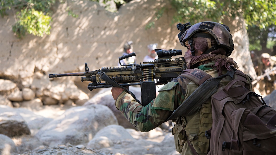 NANGARHAR, Afghanistan (July 22, 2018) – An Afghan Special Security Forces member pauses during a patrol after conducting a raid that killed Mullah Nasim Mushfaq, Taliban shadow governor of Kapisa, and Qari Ehsanullah, Taliban district shadow governor of Tagab, July 22, 2018.  (NATO photo by Spc. Casey Dinnison)