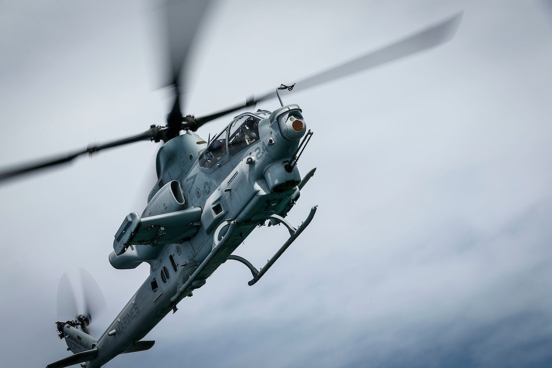 A U.S. Marine Corps AH-1Z Viper assigned to Marine Light Attack Helicopter Squadron 367 participates in a simulated tactical recovery of aircraft and personnel mission during Rim of the Pacific exercise over the Hawaiian islands, July 24, 2018. RIMPAC provides high-value training for task-organized, highly capable Marine Air-Ground Task Force and enhances the critical crisis response capability of U.S. Marines in the Pacific. Twenty-five nations, 46 ships, five submarines, about 200 aircraft and 25,000 personnel are participating in RIMPAC from June 27 to Aug. 2 in and around the Hawaiian Islands and Southern California.