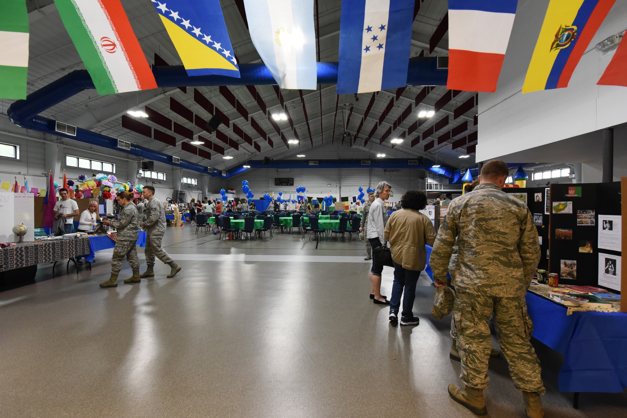 Base residents explore the many cultures displayed at the multicultural expo June 20, 2018, at Grand Forks Air Force Base, North Dakota. The event consisted of booths that were decorated and themed toward the many cultures around the world, along with food samples and fun facts. (U.S. Air Force photo by Airman 1st Class Melody Wolff)