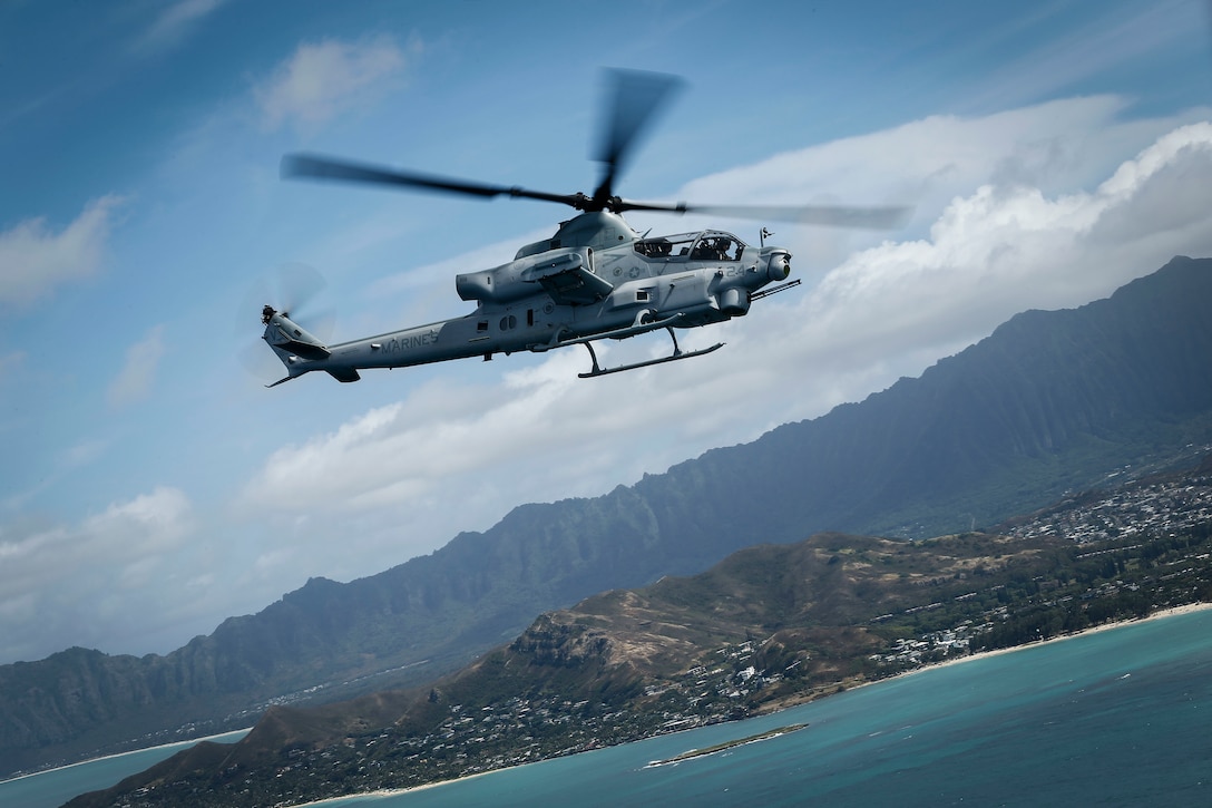 A U.S. Marine Corps AH-1Z Viper assigned to Marine Light Attack Helicopter Squadron 367 participates in a simulated tactical recovery of aircraft and personnel mission during Rim of the Pacific exercise over the Hawaiian islands, July 24, 2018. RIMPAC provides high-value training for task-organized, highly capable Marine Air-Ground Task Force and enhances the critical crisis response capability of U.S. Marines in the Pacific. Twenty-five nations, 46 ships, five submarines, about 200 aircraft and 25,000 personnel are participating in RIMPAC from June 27 to Aug. 2 in and around the Hawaiian Islands and Southern California.