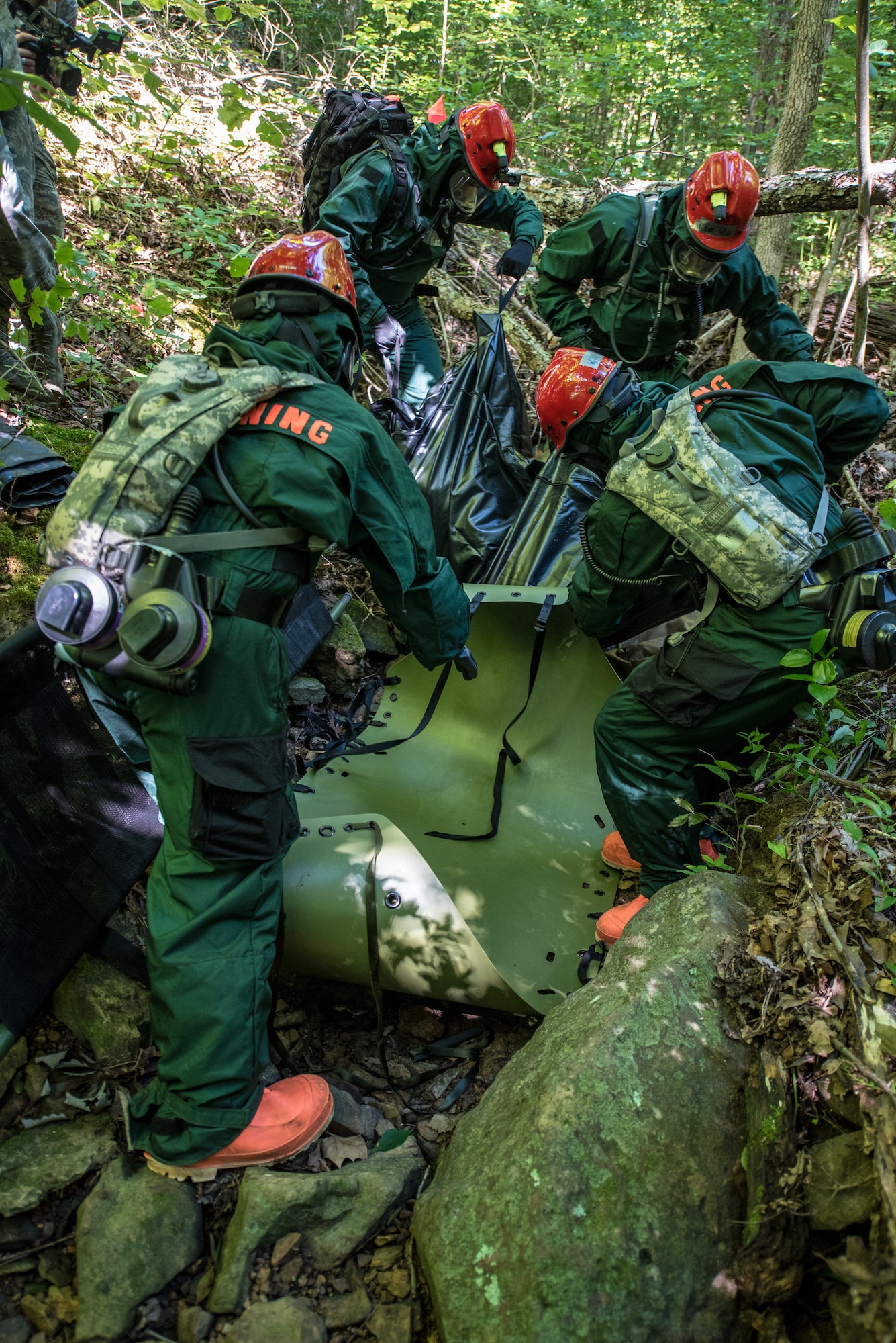 Senior Airman Parker Hale, a member of the Kentucky Air National Guard’s Fatality Search and Recovery Team, briefs FSRT members before a training exercise at Rough River State Resort Park in Falls of Rough, Ky., on July 18, 2018. Thirteen members of the 123rd Airlift Wing participated in the three-day exercise to simulate the recovery and repatriation of fallen service members. (U.S. Air National Guard photo by Master Sgt. Phil Speck)