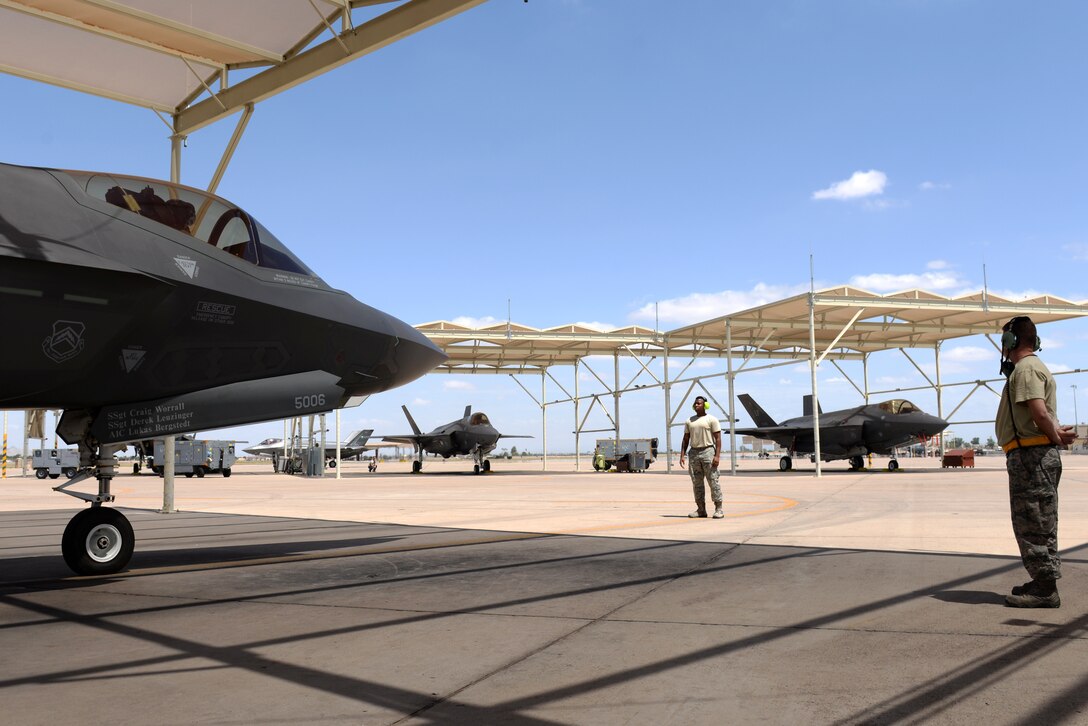 61st Aircraft Maintenance Unit maintainers prepare to taxi-out a 61st Fighter Squadron F-35A Lightning II for a transitional training sortie July 18, 2018, at Luke Air Force Base, Ariz. The 61st FS flies sorties daily as part of routine flight training operations. (U.S. Air Force photo by Senior Airman Ridge Shan)