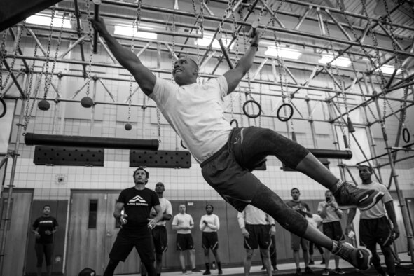 Senior Airman Douglas Lord, 633rd Force Support Squadron, certifies on the Air Force Alpha Warrior Battle Rig during a two-day course at Joint Base Langley-Eustis, Va., July 25, 2018. The specialized fitness equipment gives Airmen a means to exercise their bodies in a new way. (Courtesy photo of U.S. Air Force)