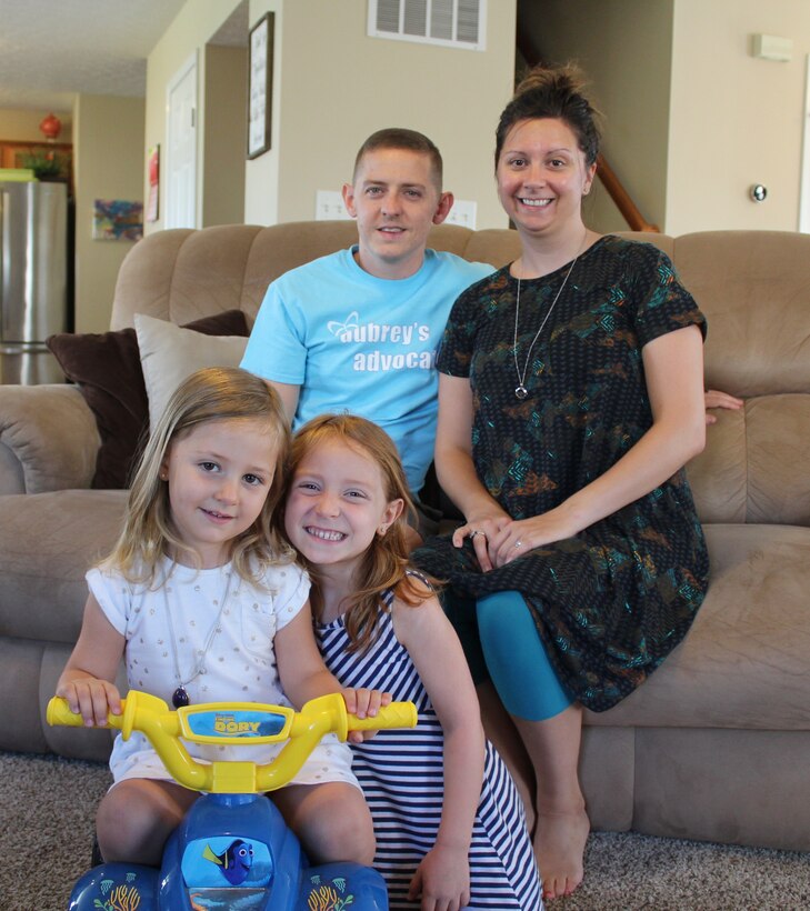 The Inmans, Bryan and Aimee and their daughters, front left to right, Adalyn and Aubrey, try to make their family and Aubrey’s life who has cystic fibrosis, as normal as possible. Aubrey enjoys swimming, drawing and riding her bicycle. (U.S. Air Force Photo/Stacey Geiger)