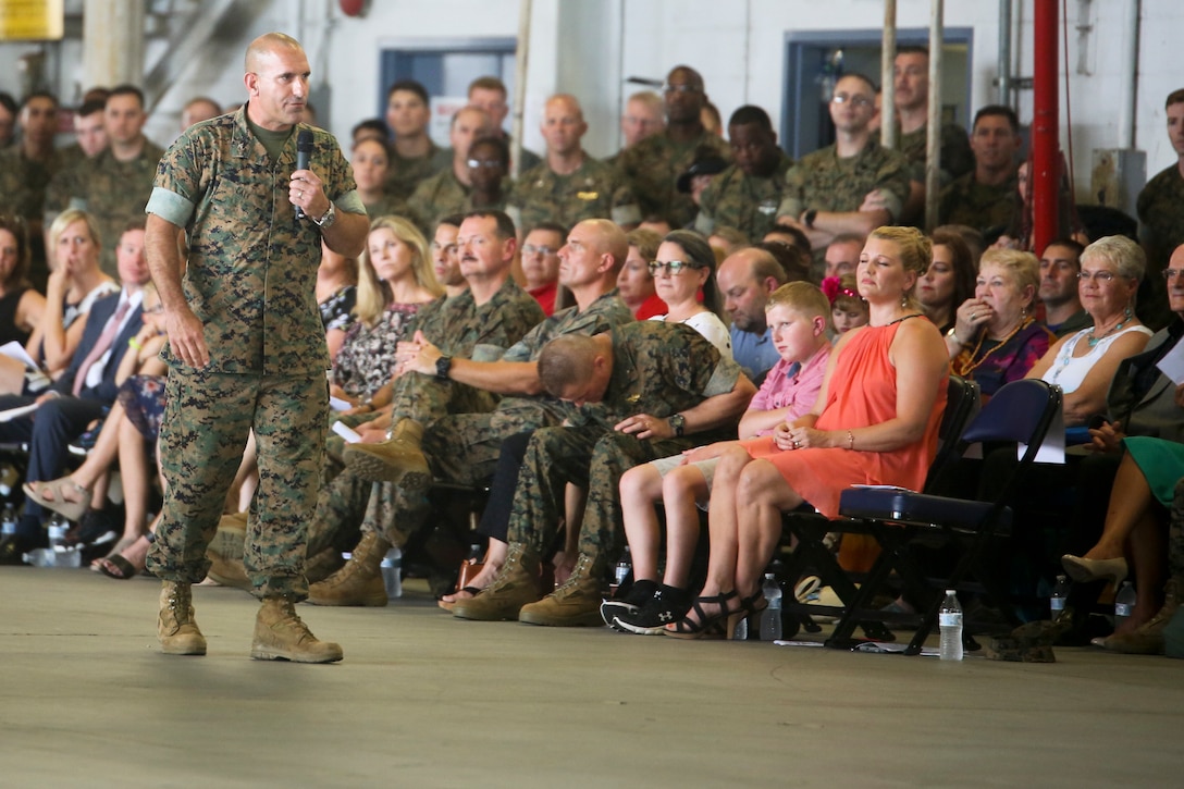 Col. Frank Latt, the outgoing commanding officer of Marine Aircraft Group 31, addresses the crowd during a change of command ceremony aboard Marine Corps Air Station Beaufort July 19. Latt relinquished command of Marine Aircraft Group 31 to Col. Matthew H. Phares after commanding MAG-31 for 17 months.