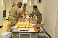 Members of the D.C. National Guard's 372nd Military Police Battalion prepare bag lunches for Soldiers on duty for July 4th mission