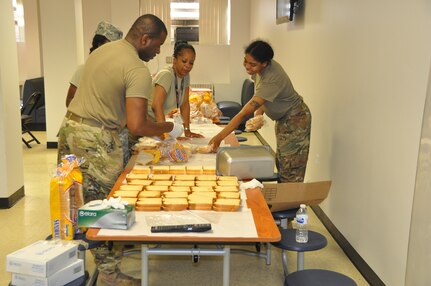 Members of the D.C. National Guard's 372nd Military Police Battalion prepare bag lunches for Soldiers on duty for July 4th mission
