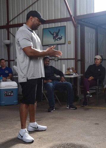 Tech. Sgt. Brandon Davis, 30th Space Wing religious affairs airman, introduces himself to the Leap of Faith event attendees July 21, 2018 at Skydive Santa Barbara, Lompoc, Calif. Davis led the beginning discussion and opened the floor for introductions prior to the main event.  (U.S. Air Force photo by Airman First Class Aubree Milks/Released)