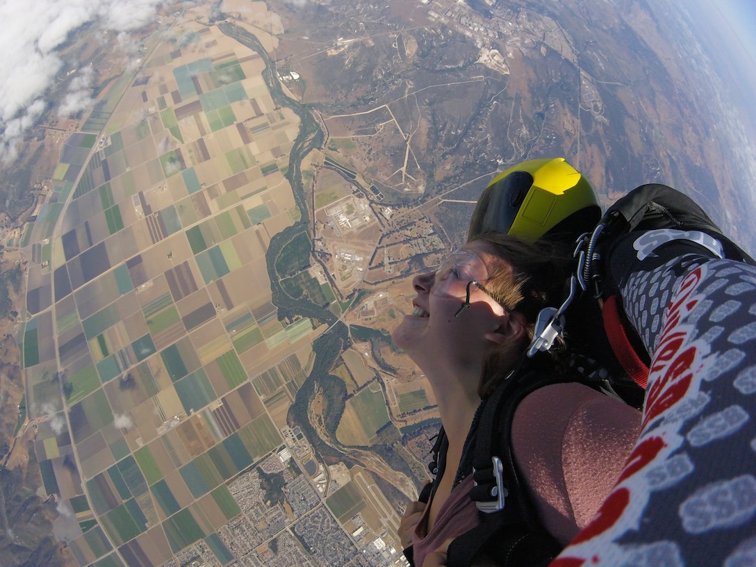 Airman First Class Aubree Milks, 30th Public Affairs photojournalist, gravitates towards the earth July 21, 2018 at Skydive Santa Barbara, Lompoc, Calif. Milks soars through the air from 13,000 feet, untouched by a thing. (Complimentary photo)
