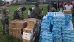 New York Army National Guard Soildiers assigned to the 442nd Military Police Company assist the New York Army National Guard's 3rd Battalion 142nd Aviation in delivering supplies in Bayamon and Orocovis, Puerto Rico on Oct. 11, 2017. Staff Sgt.  Mykel Christofferson, Staff Sgt Alberto Espinar,SPC Dewayne Alison and SPC Rebecca Batista and hand out some of the 4,320 Meals Ready to Eat and 9,216 water bottles iprovided.