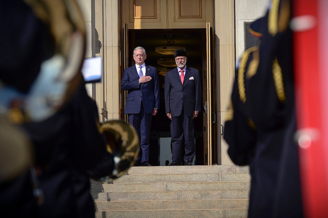 Defense Secretary James N. Mattis and a foreign dignitary stand at the top of the steps at the Pentagon.
