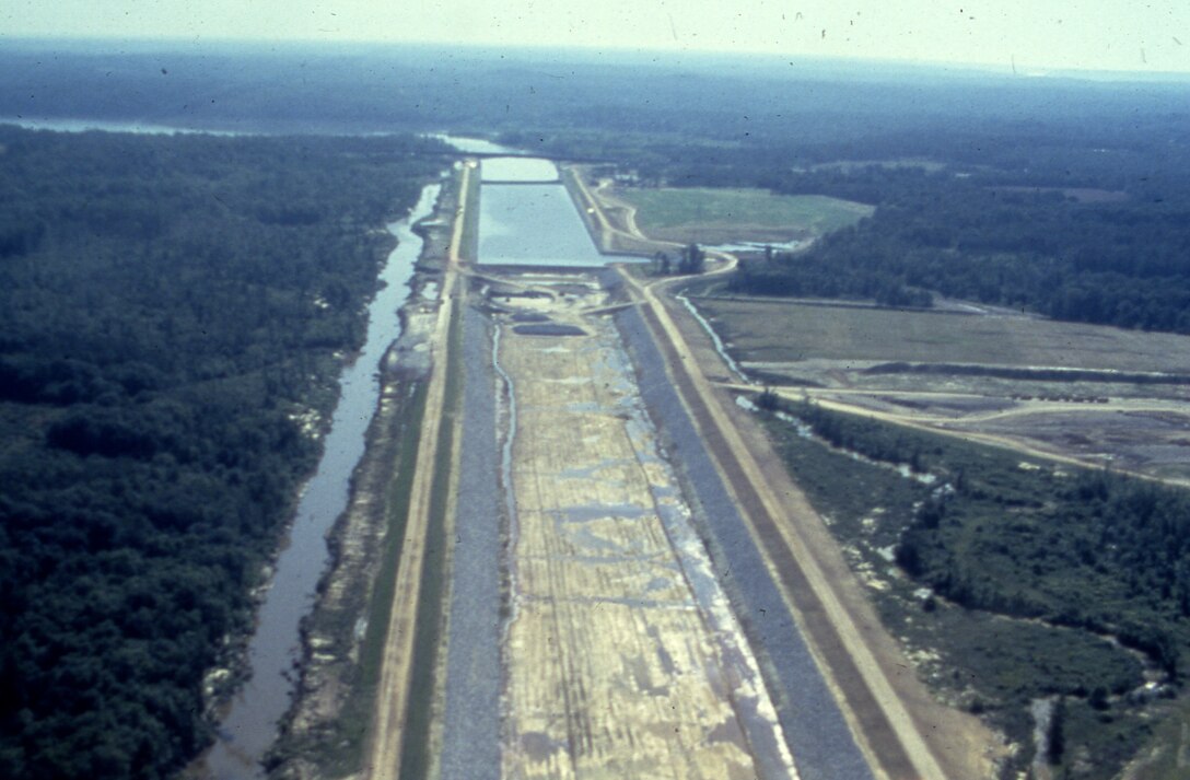 This is an aerial view of the Tennessee-Tombigbee Waterway under construction Sept. 4 1981. The U.S. Army Corps of Engineers Nashville District built the northern 29 miles of the project, including the massive 27-mile divide cut, which connected the waterway with Pickwick Lake on the Tennessee River. (USACE Photo)