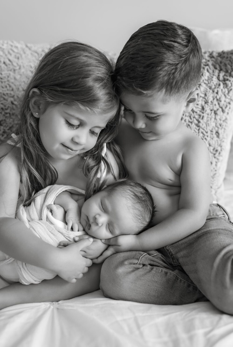 Chief Warrant Officer 2 Robert Holtz’s children Evelyn and Bobby pose with their new brother Alexander for a picture. Holtz will meet his son, who was born during the deployment, for the first time upon his return home. (Photo courtesy of CWO2 Robert Holtz)