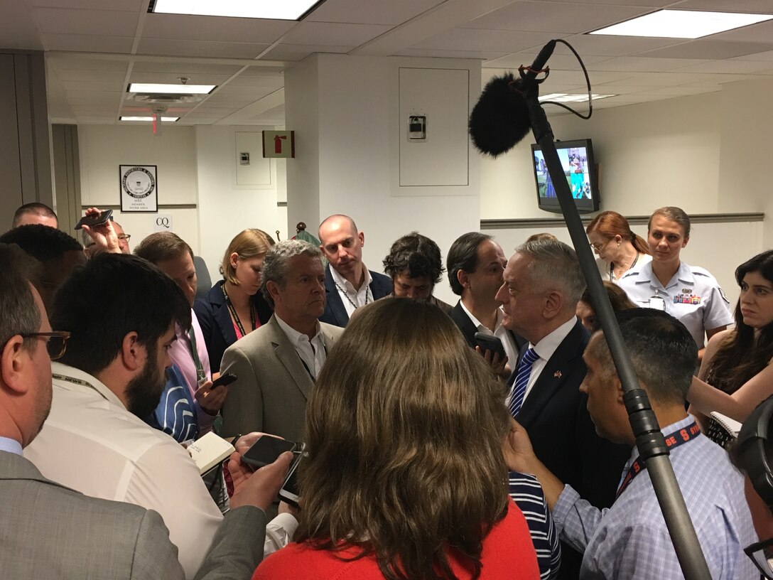 Defense Secretary James N. Mattis, center right, meets with reporters and takes their questions in the Pentagon.