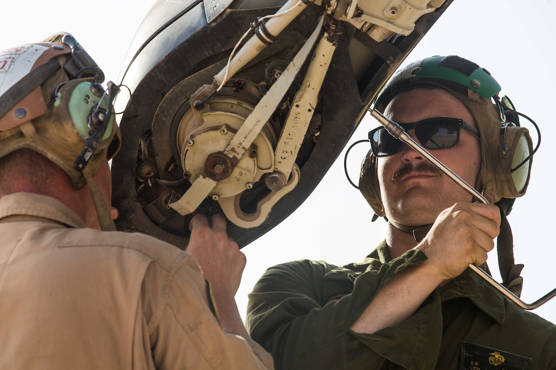 IRAQ (June 8, 2018) U.S. Marines perform routine maintenance on the rotor blade of an MV-22B Osprey during routine maintenance in support of Combined Joint Task Force – Operation Inherent Resolve (CTJF-OIR) on Al Asad Air Base, Iraq, June 8, 2018. CTJF-OIR is the military arm of the Global Coalition to defeat ISIS in designated parts of Iraq and Syria.  (U.S. Marine Corps photo by Cpl. Jered T. Stone/Released)