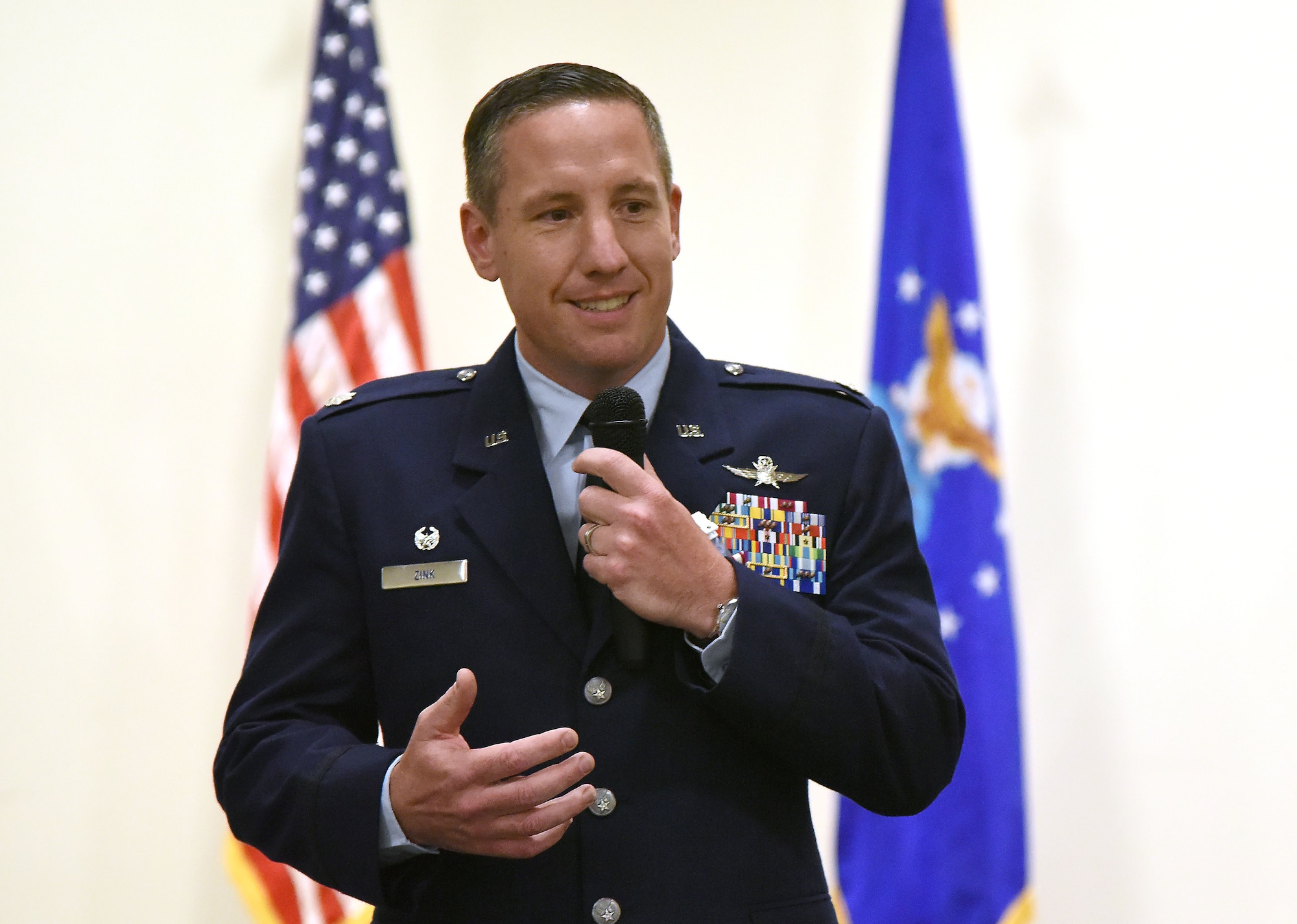 U.S. Air Force Lt. Col. Michael Zink, outgoing 338th Training Squadron commander, delivers remarks during the 338th TRS change of command ceremony in the Roberts Consolidated Aircraft Maintenance Facility at Keesler Air Force Base, Mississippi, July 26, 2018. The passing of the guidon is a ceremonial symbol of exchanging command from one commander to another. (U.S. Air Force photo by Kemberly Groue)