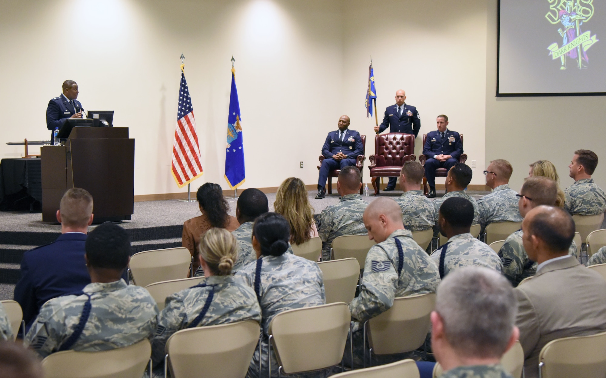 U.S. Air Force Lt. Col. Andre Johnson, incoming 338th Training Squadron commander, delivers remarks during the 338th TRS change of command ceremony in the Roberts Consolidated Aircraft Maintenance Facility at Keesler Air Force Base, Mississippi, July 26, 2018. Johnson assumed command from Lt. Col. Michael Zink, outgoing 338th TRS commander. (U.S. Air Force photo by Kemberly Groue)