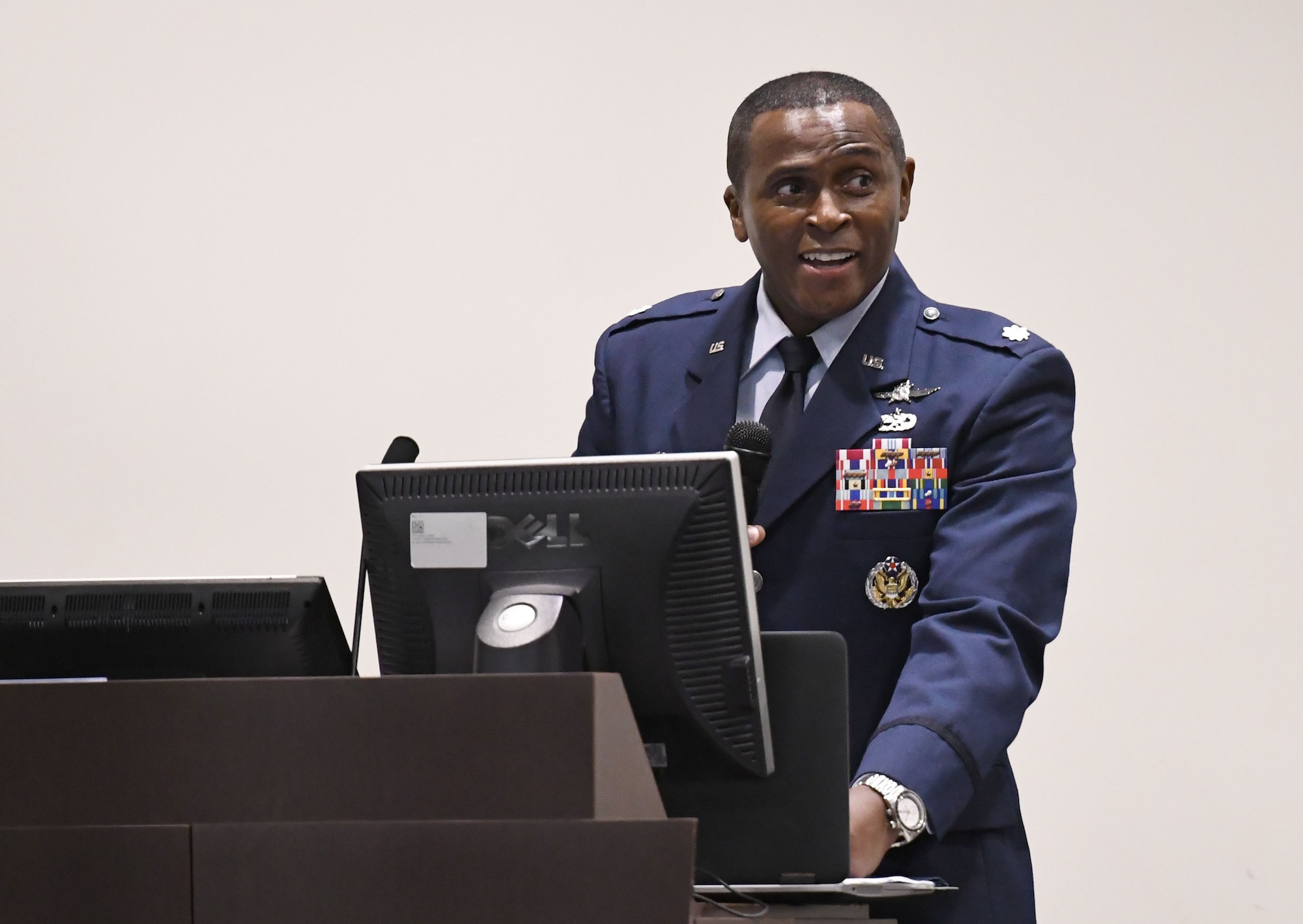 U.S. Air Force Lt. Col. Andre Johnson, incoming 338th Training Squadron commander, delivers remarks during the 338th TRS change of command ceremony in the Roberts Consolidated Aircraft Maintenance Facility at Keesler Air Force Base, Mississippi, July 26, 2018. Johnson assumed command from Lt. Col. Michael Zink, outgoing 338th TRS commander. (U.S. Air Force photo by Kemberly Groue)