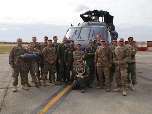 The 2018 Royal International Air Tattoo, the world’s largest air show, selected an HH-60G Pave Hawk helicopter from the 943rd Rescue Group, Tucson, Ariz., as the winner of best static display out of hundreds of aircraft July 14. Along with the 943rd RQG commander, Col. John Beatty, maintenance and operations Airmen posed with the trophy and the winning aircraft at the tattoo for their roles in taking the win. The international 100-year celebration boasted 302 aircraft from 43 air arms representing 30 nations, which drew a crowd of more than 185,000 from July 13 – 15. (U.S. Air Force photo by Master Sgt. Brock Woodward)