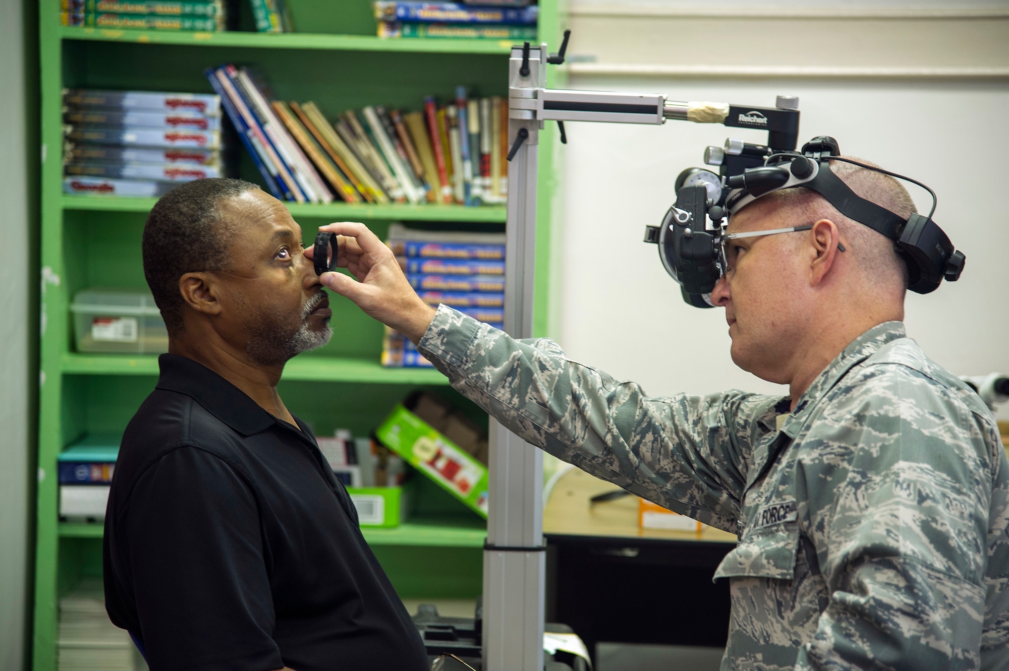 U.S. Air Force Lt. Col. Gregg Russell, of Marietta, Ga., an optometrist for the Air Force Reserve’s 919th Special Operations Medical Squadron, Duke Field, Florida, conducts an eye exam for a local patient in Thomson, Ga., July 10, 2018, during the East Central Georgia Innovative Readiness Training. An IRT provides hands-on, real-world training to improve readiness and interoperability for service members in complex contingency environments while providing key services for American communities. (U.S. Air Force photo by Master Sgt. Theanne Herrmann)