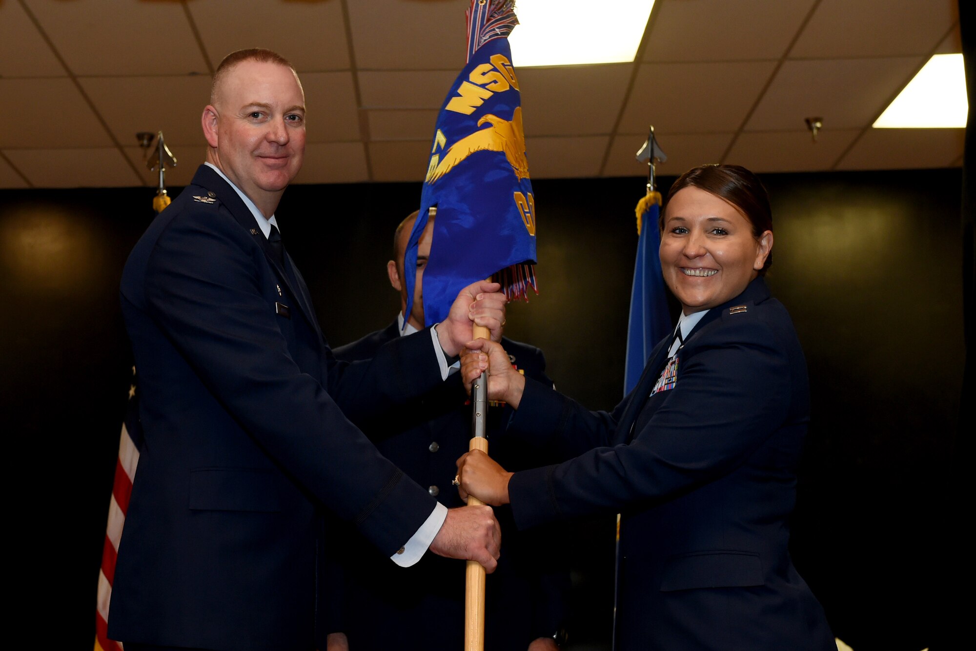 U.S. Air Force Capt. Jennifer Hughes, commander of the 97th Contracting Flight, assumes command, July, 27, 2018, at Altus Air Force Base, Okla.