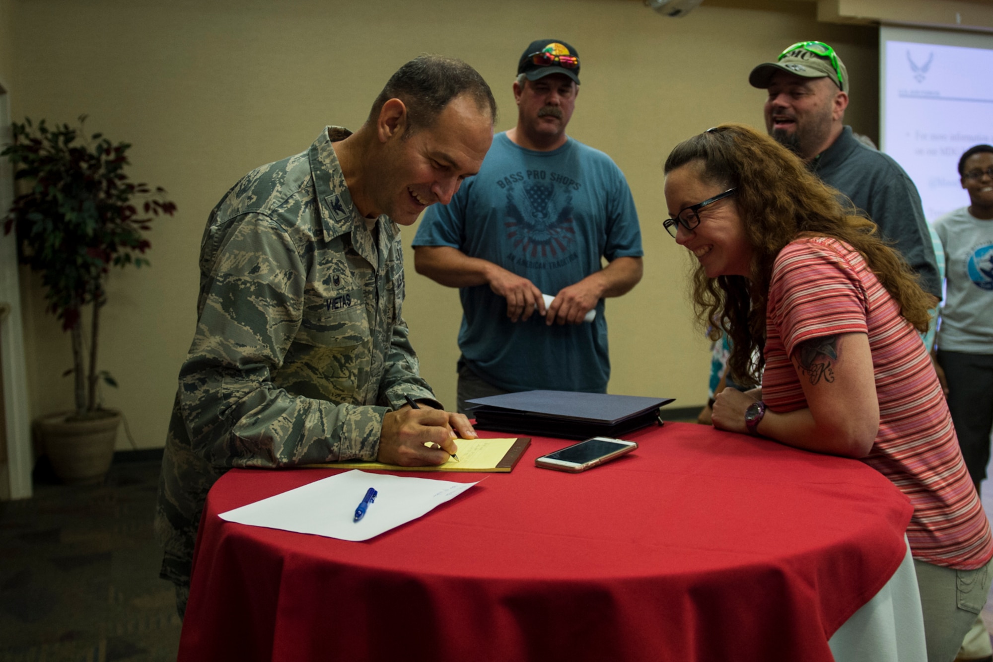 Col. Jay Vietas, 23d Medical Group commander, talks with retirees during a medical benefits town hall, July 26, 2018, at Moody Air Force Base, Ga. In order to align with a recent Air Force Medical Service policy update, the 23d Medical Group is slated to reassign approximately 1,560 retirees and their dependents to off-base TRICARE providers, on Aug. 17, 2018. (U.S. Air Force photo by Andrea Jenkins)