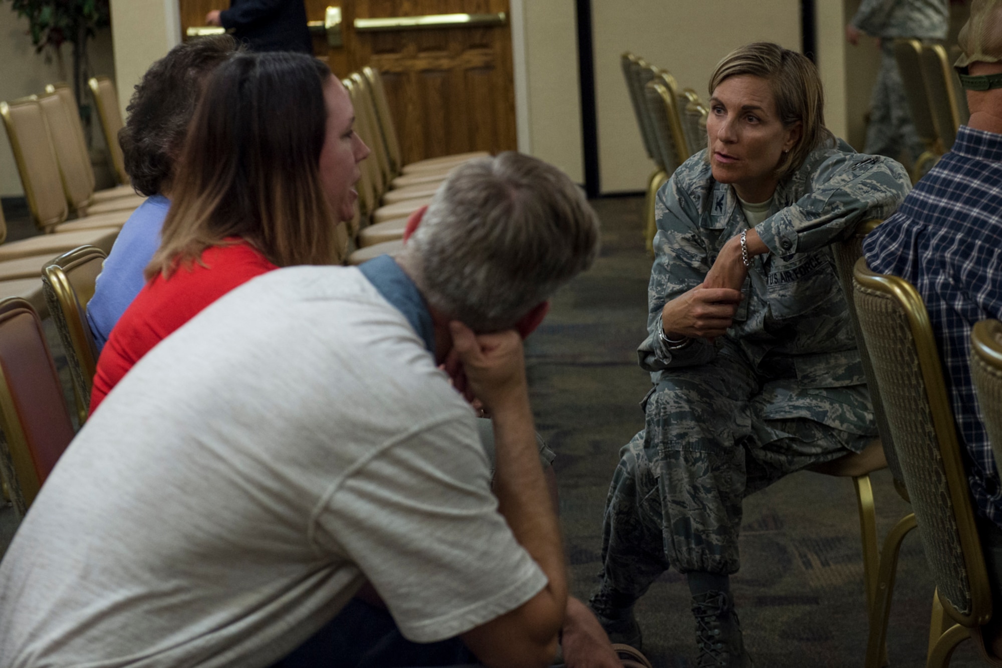 Col. Jennifer Short, 23d Wing commander, talks with retirees during a medical benefits town hall, July 26, 2018, at Moody Air Force Base, Ga. In order to align with a recent Air Force Medical Service policy update, the 23d Medical Group is slated to reassign approximately 1,560 retirees and their dependents to off-base TRICARE providers, on Aug. 17, 2018.