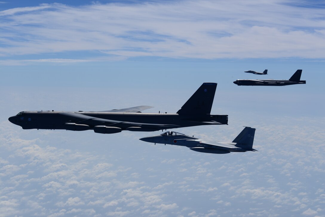 Two U.S. Air Force B-52H Stratofortress bombers and two Koku Jieitai (Japan Air Self-Defense Force) F-15 fighters execute a routine bilateral training mission in the vicinity of Japan, July 26, 2018. This mission was flown in support of U.S. Indo-Pacific Command’s Continuous Bomber Presence (CBP) operations, which are a key component to improving combined and joint service interoperability. Bilateral training missions such as this allow the two countries to improve upon combined capabilities, tactical skills, and relationships. (Courtesy Photo)