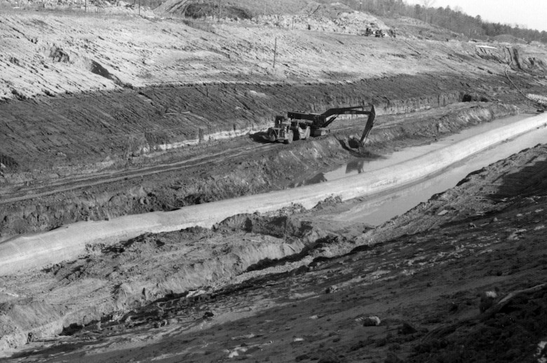Barges move equipment into the northern portion of the Tennessee-Tombigbee Waterway March 18, 1976 near Dennis, Miss., during the early days of its construction. (Courtesy Asset)