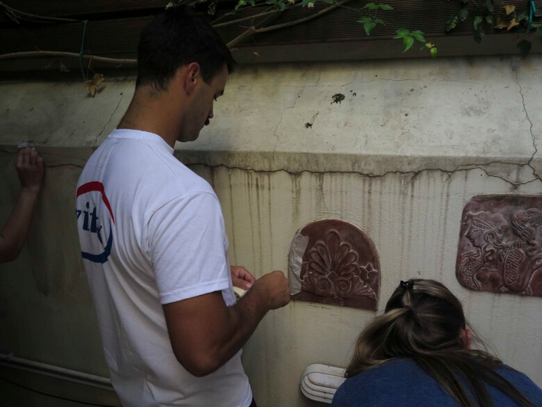 ATHENS, GREECE ( June 7, 2018) Hospital Corpsman 3rd Class Christopher Moore, assigned to Combat Logistics Battalion 26, 26th Marine Expeditionary Unit, and embarked aboard the San Antonio class amphibious transport dock USS New York (LPD 21), paints a wall at the Muscular Dystrophy Association center during a community relations event in Athens, Greece, June 7, 2018. The U.S. Navy often takes the time to give back to the communities it visits to strengthen relationships with NATO allies and to help promote the U.S. Navy’s global service. U.S. 6th Fleet, headquartered in Naples, Italy, conducts the full spectrum of joint and naval operations, often in concert with allied and interagency partners, in order to advance U.S. national interests and security and stability in Europe and Africa. (U.S. Marine Corps photo by Cpl. Juan A. Soto-Delgado/Released)