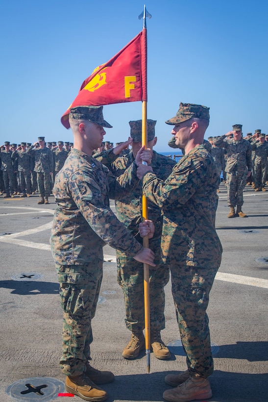 MEDITERRANEAN SEA (May 17, 2018) – U.S. Marine Corps Maj. Joseph Murphy, commanding officer, Fox Company, Battalion Landing Team, 2nd Battalion, 6th Marine Regiment, 26th Marine Expeditionary Unit, relinquishes his command to Capt. Robert Hindle at a change-of-command ceremony aboard the Harpers Ferry-class dock landing ship USS Oak Hill (LSD 51). Oak Hill, with the embarked 26th MEU is deployed to reassure allies and partners and preserve the freedom of navigation and the free flow of commerce in the region. (U.S. Marine Corps photo by Cpl. Austin Livingston/Released)