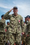 YOKOSUKA, Japan (July 27, 2018) Capt. Wilson Marks passes through side boys on the flight deck aboard the Ticonderoga-class guided-missile cruiser USS Chancellorsville (CG 62) during a change of command ceremony where Marks is relieved by Capt. Marc D. Boran as the ship’s commanding officer. Chancellorsville is forward-deployed to the U.S. 7th Fleet area of operations in support of security and stability in the Indo-Pacific region. (U.S. Navy photo by Mass Communication Specialist 2nd Class Sarah Myers/Released)