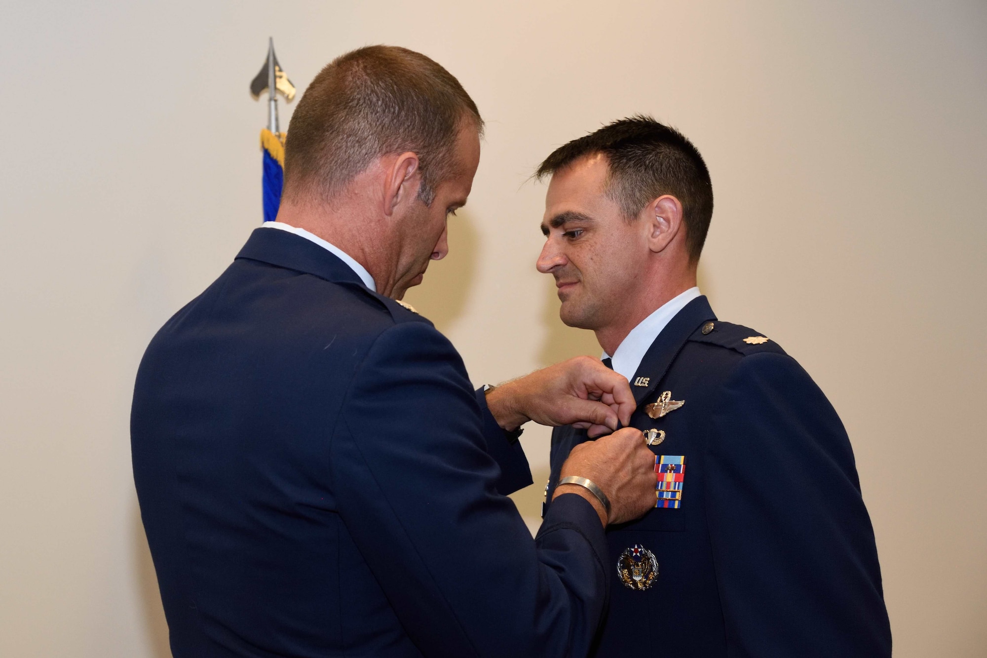 Lt. Col. (retired) Matthew Wehner (left) clips the Meritorious Service Medal to Lt. Col. Stuart M. Rubio, commander of the Air Force Reserve’s 815th Airlift Squadron “Flying Jennies” during Rubio’s retirement ceremony held July 28, 2018, at the Roberts Consolidated Maintenance Facility, Keesler Air Force Base, Mississippi. Rubio, an active-duty C-130 pilot who has been commander of the Flying Jennies since February of 2016, will still continue to serve as commander of the squadron, but instead as a reservist as part of the Regular Air Force to Air Force Reserve Program. (U.S. Air Force photo by Tech. Sgt. Ryan Labadens)