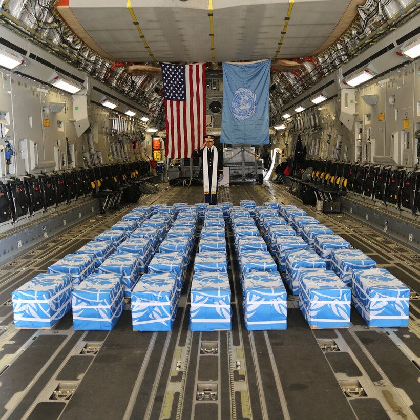 United Nations Command Chaplain U. S. Army Col. Sam Lee performs a blessing of sacrifice and remembrance on the 55 cases of remains returned by the Democratic People's Republic of Korea at Osan Air Base, Republic of Korea, Friday. (Photo by US Army Sergeant Quince Lanford.)