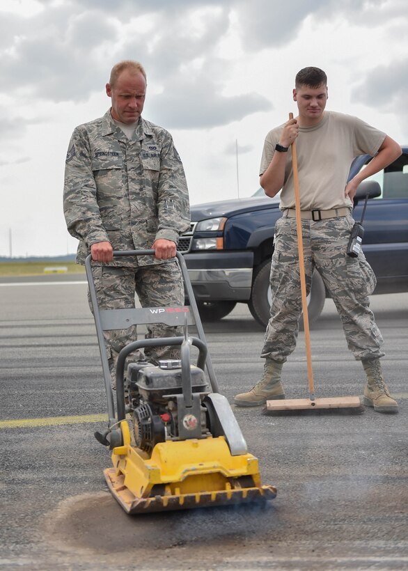 Staff Sgt. David Springsteen, a pavements and construction helper from the 910th Civil Engineer Squadron, uses a compactor to repair Spangdahlem Airbase’s flightline, July 12, 2018.